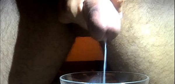  ten thick squirts of hot cum in a glass with slowmotion